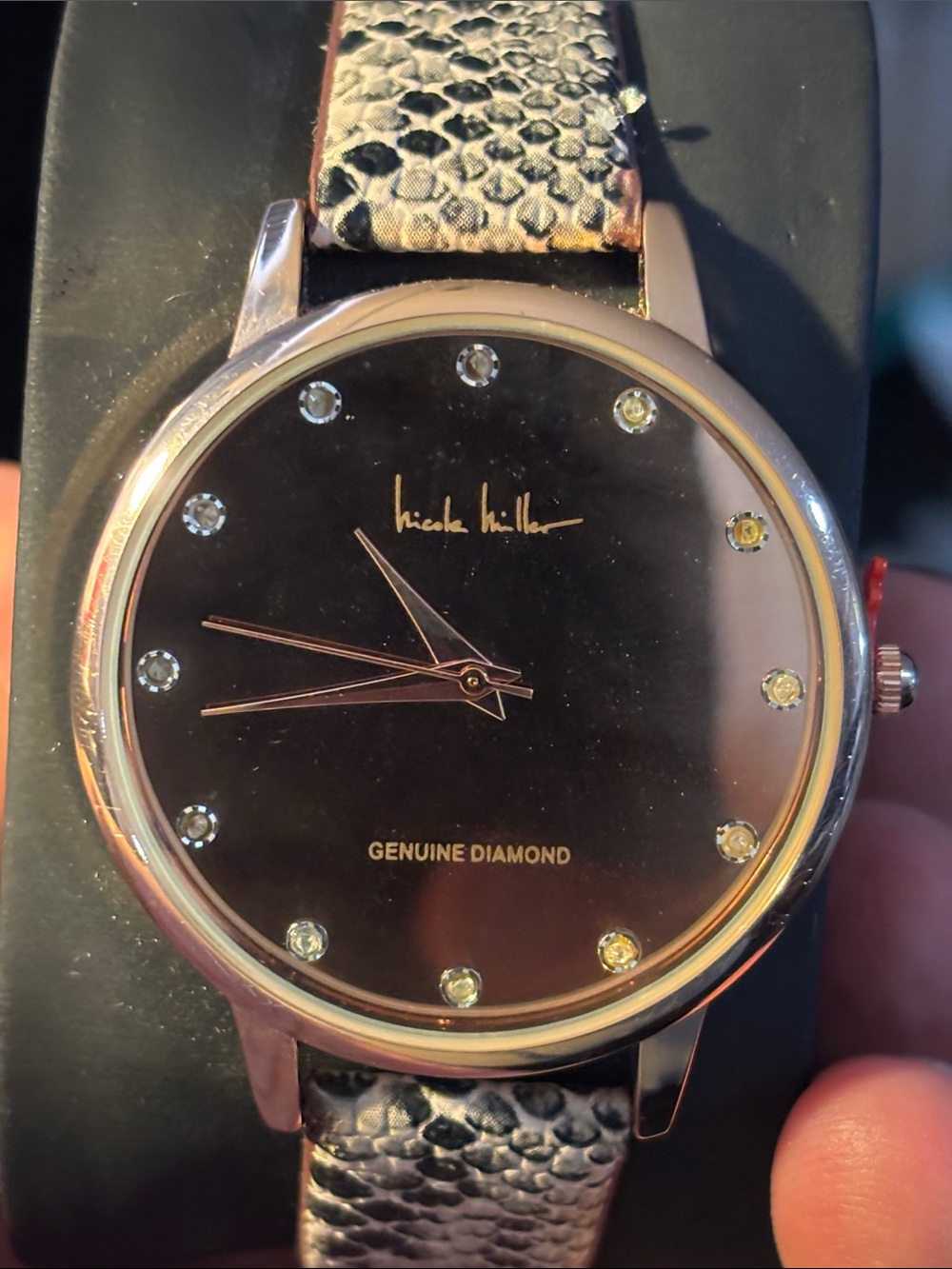 Nicole Miller Black Dial Watch with Snake-Pattern Strap and Gold Accents